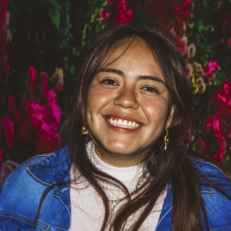 Kaveri Mehta, Lead Design Curator at SignalKernelClear, reviewing corporate floral arrangements